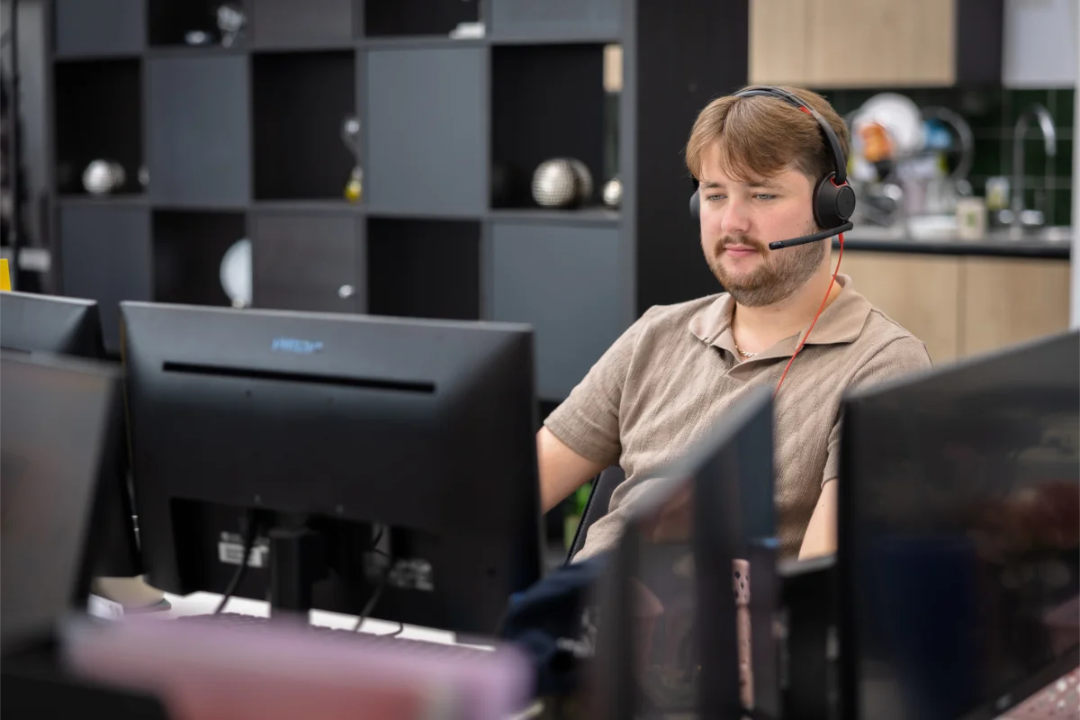 Tayler and Kieran working at their desks in Wingman UK office
