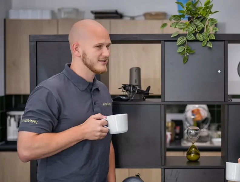 Josh and Mark having a coffee and conversation in the office