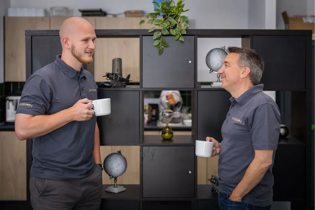 Josh and Mark having a coffee and conversation in the office